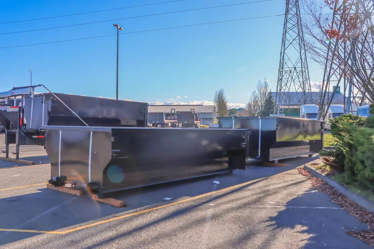 Roll-off dumpster ready for waste disposal at job site for 12 Yard Dumpster Rental in Canton